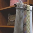 Ties are not easily stored, this solution keeps ties off the floor and slides into the closet system so out of the way.
